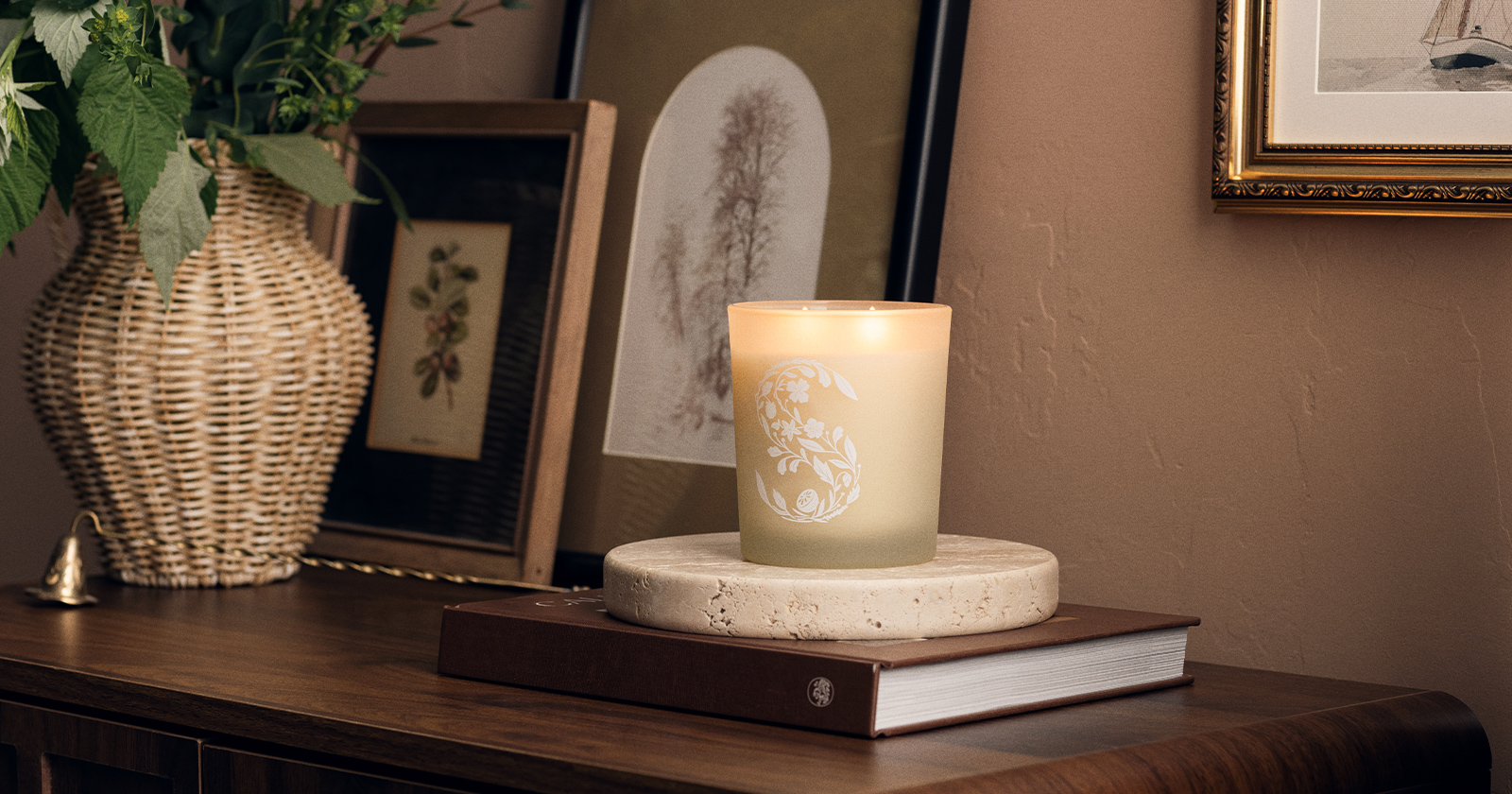 A glowing safe scented candle sitting on a rustic wooden table enhancing home ambiance.