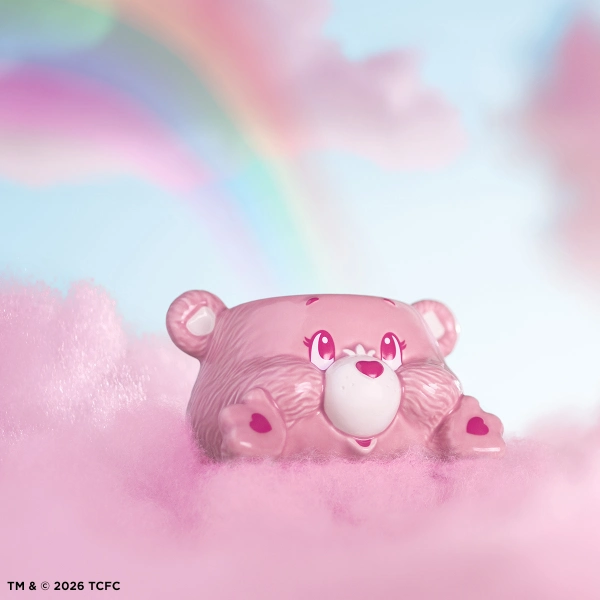 A 3.5-inch pink ceramic Scentsy Cheer Bear Wax Warmer sculpted like the iconic character resting playfully on soft pink clouds.