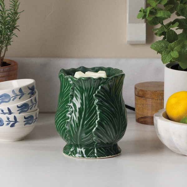 The Scentsy Etched Sage Electric Fragrance Melter featuring a deep green ceramic design with sculpted overlapping botanical leaves.