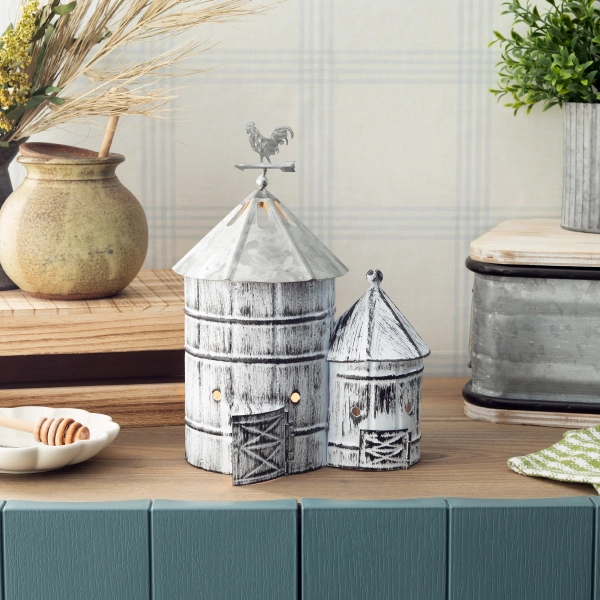 The Scentsy Farmland Electric Fragrance Melter featuring a distressed white metal twin silo design with a rooster weathervane and glowing windows.