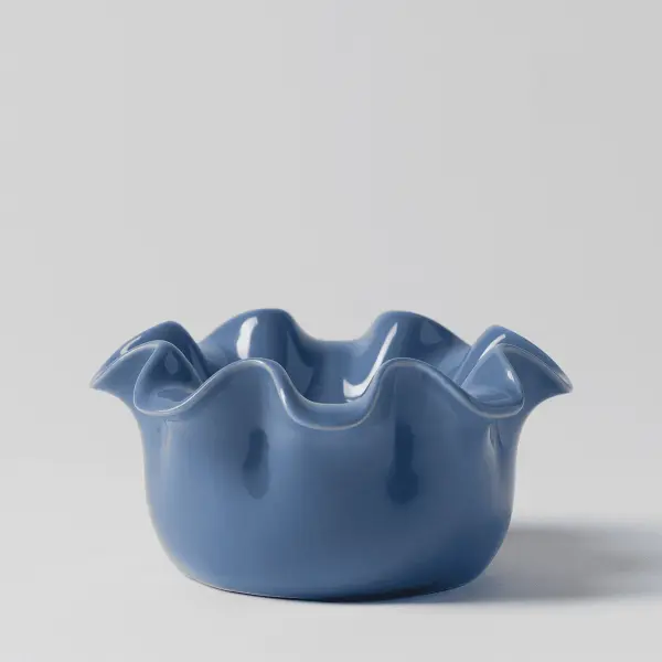 Scentsy Petite Ruffle Cerulean Wax Warmer featuring a smooth blue ceramic finish and elegantly scalloped edges sitting on a white surface.