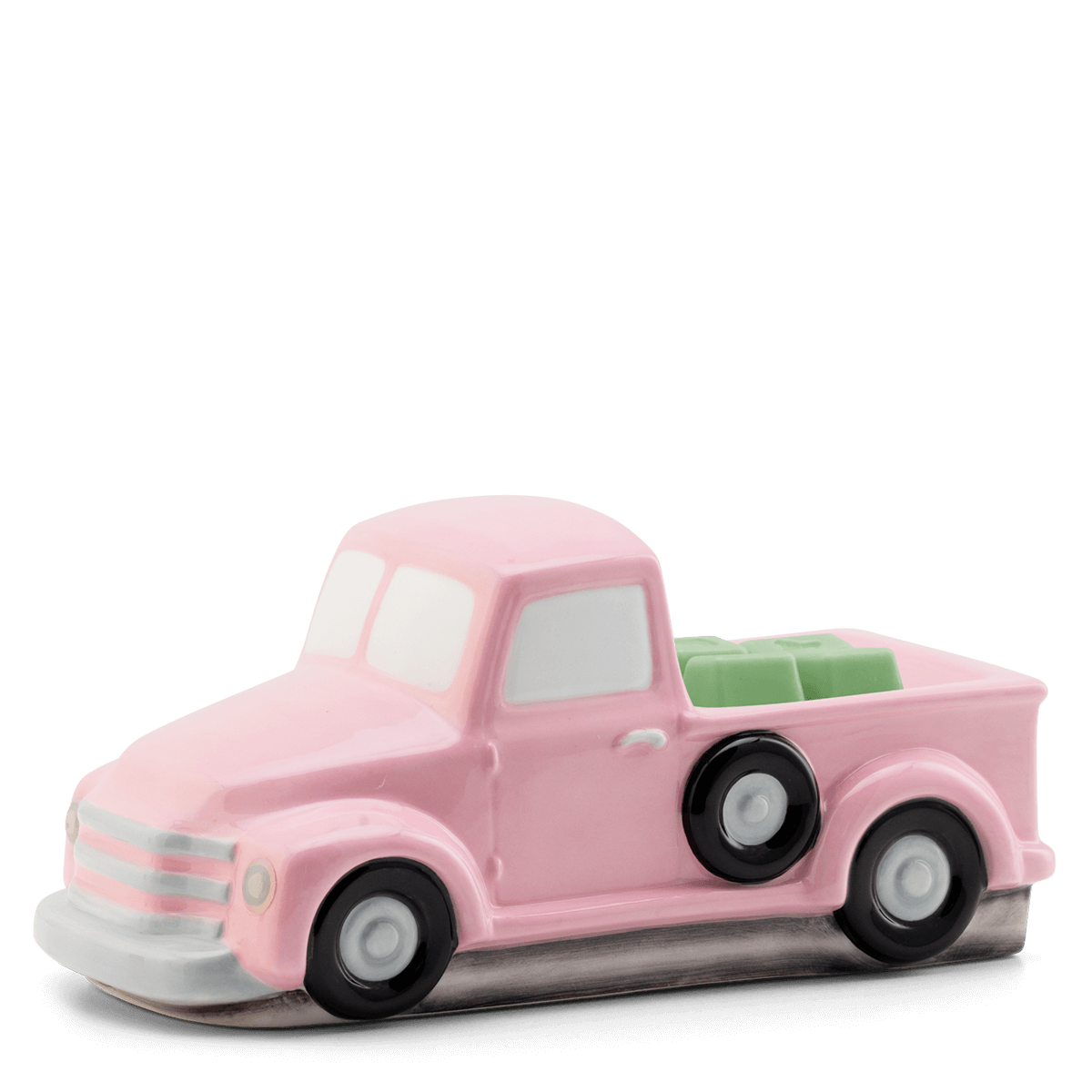 Scentsy Retro Pink Truck Wax Warmer sitting on a table, featuring a classic mid-century pickup truck design with hand-painted pink and silver details.
