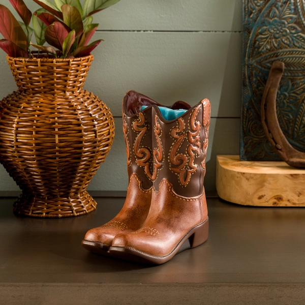 Scentsy Rodeo Wax Warmer featuring two hand-painted ceramic cowboy boots with intricate tooling and saddle tan leather finishes.