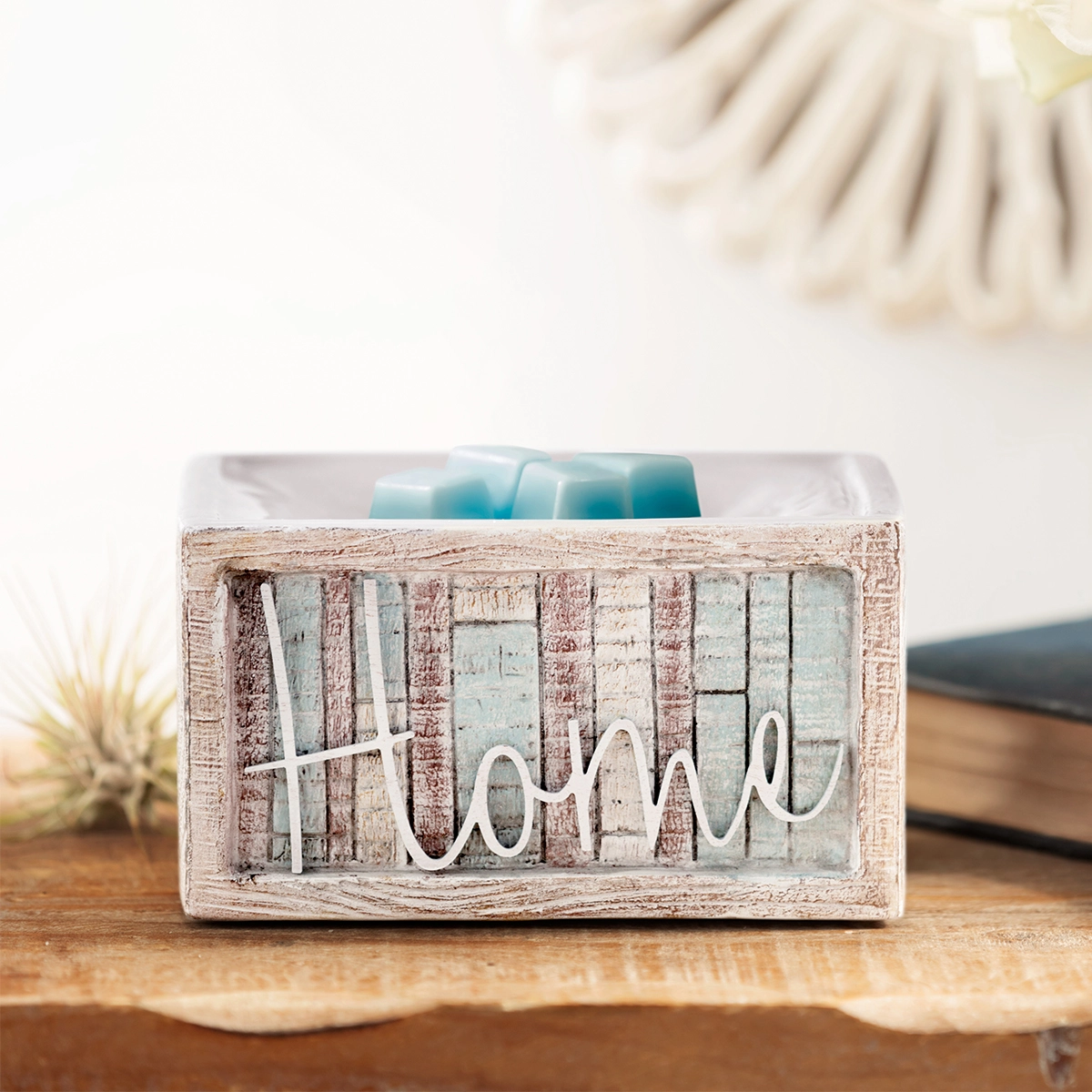 Wherever I'm With You Wax Warmer sitting on a table, featuring a hand-painted faux-wood ceramic base and a weathered top with a sentimental quote.